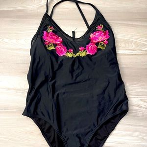 Large one piece. Slimming/flattering.